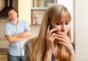Wife confer privately on the phone