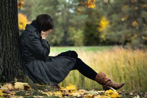 Young woman having autumn depression and crying